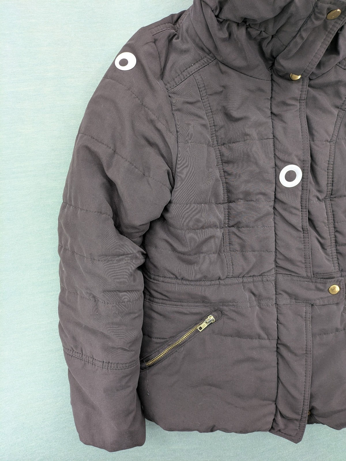 Vero Moda grey quilted jacket with high funnel neck and zippered pockets.