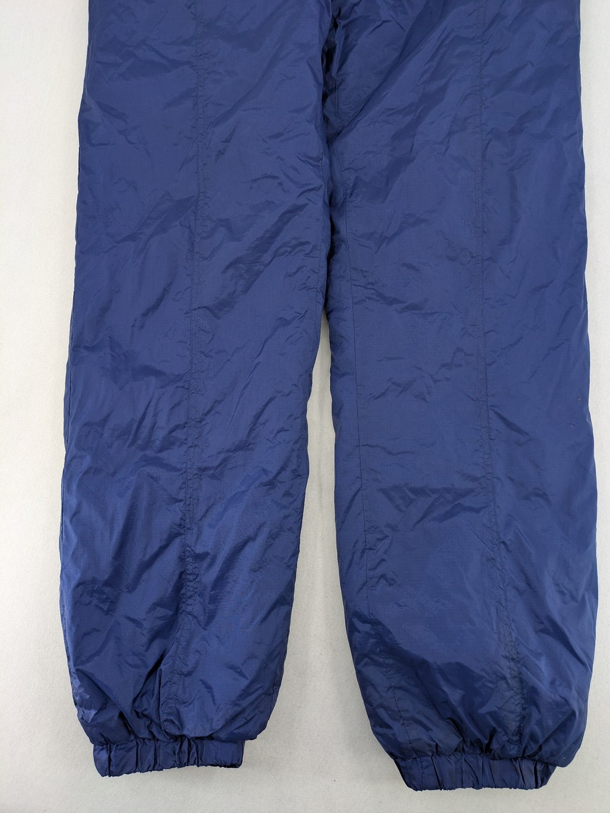 Shamp navy and yellow vintage ski jacket and pants set with retro design.