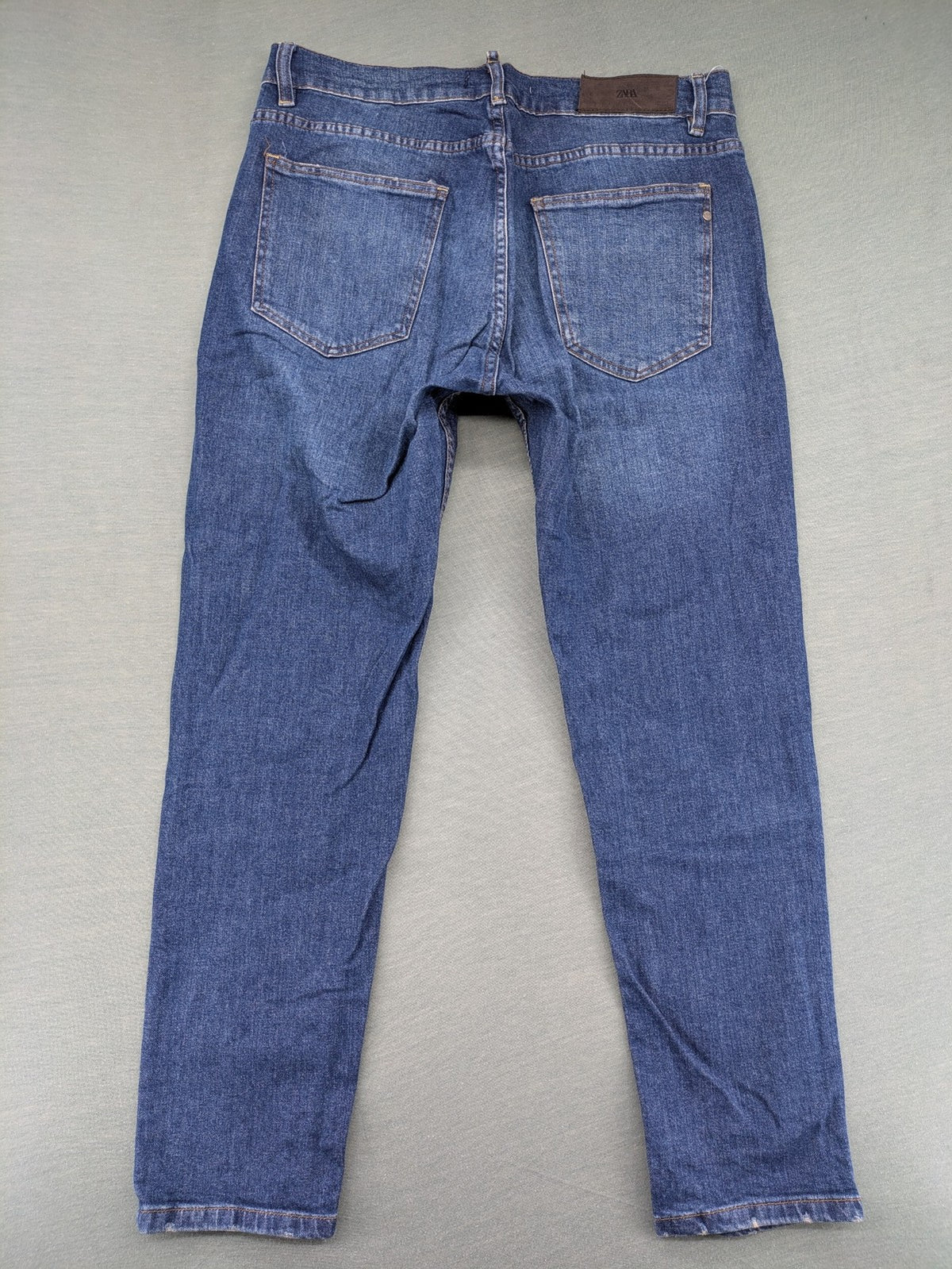 Zara blue straight jeans with medium wash, lightweight denim, and regular fit.