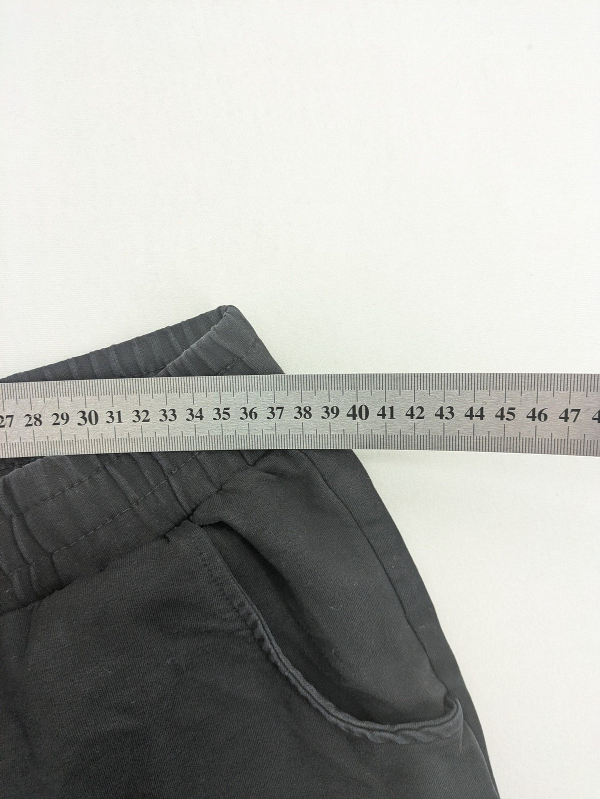 BWEST grey pants with elastic waistband and side pockets for comfort and functionality.
