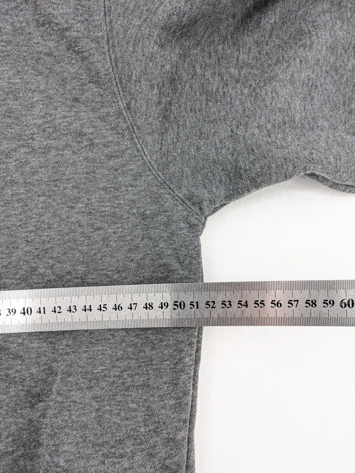 Bolf grey hoodie with pink contrast hood, kangaroo pocket, and ribbed cuffs.