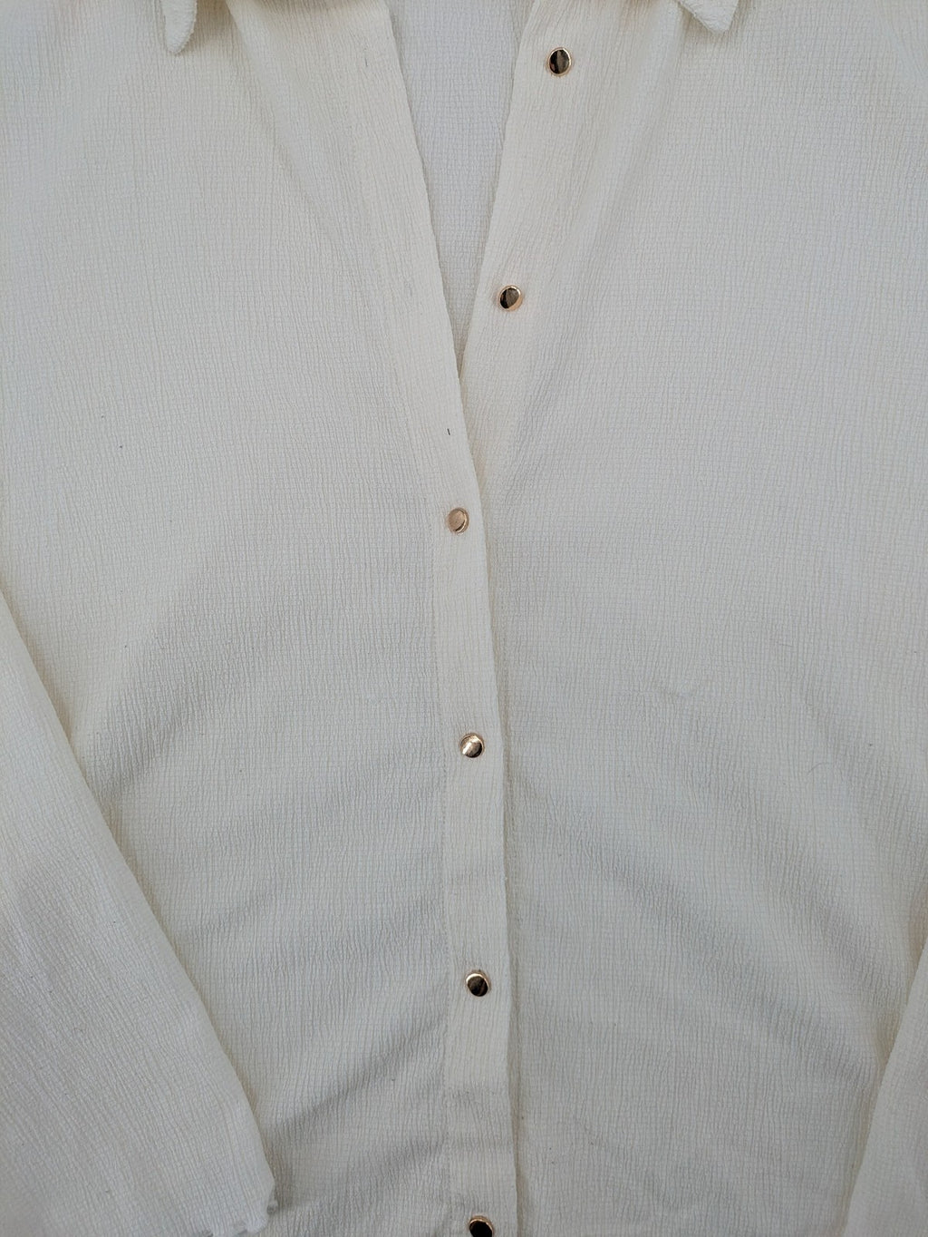 C&A cream blouse XXL textured crinkle fabric with gold button placket and wavy hem.