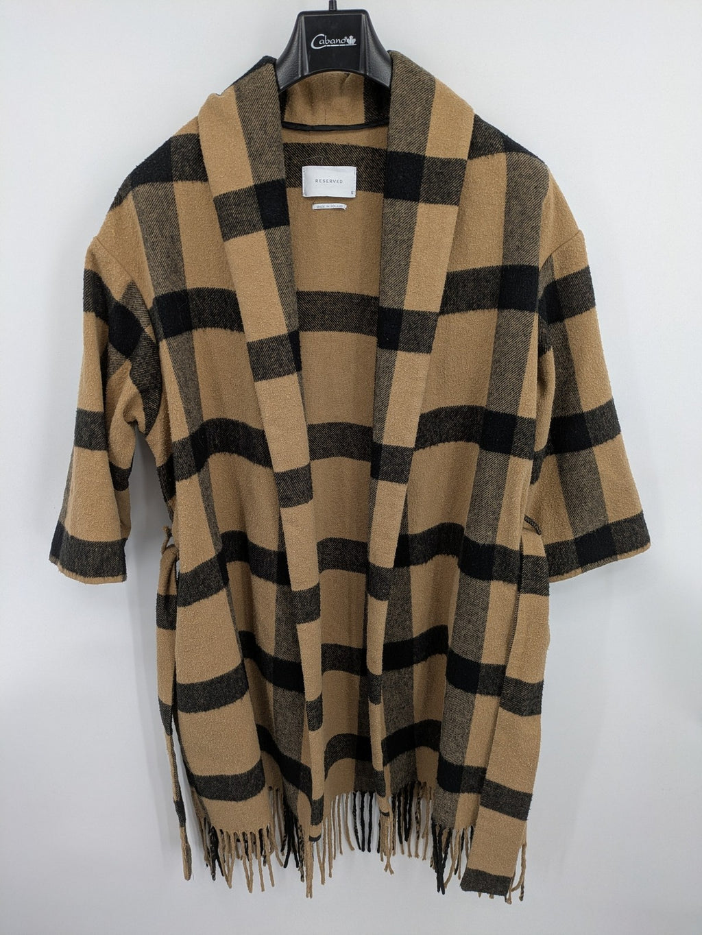 Reserved cream coat with brown and black check pattern, fringe hem, wool blend material.