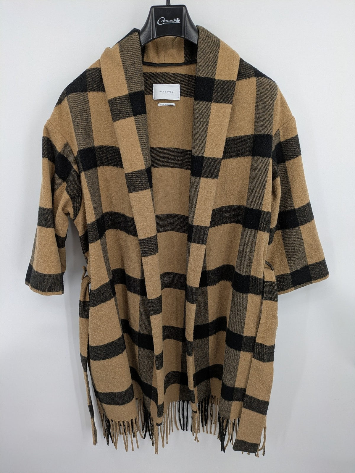 Reserved cream coat with brown and black check pattern, fringe hem, wool blend material.