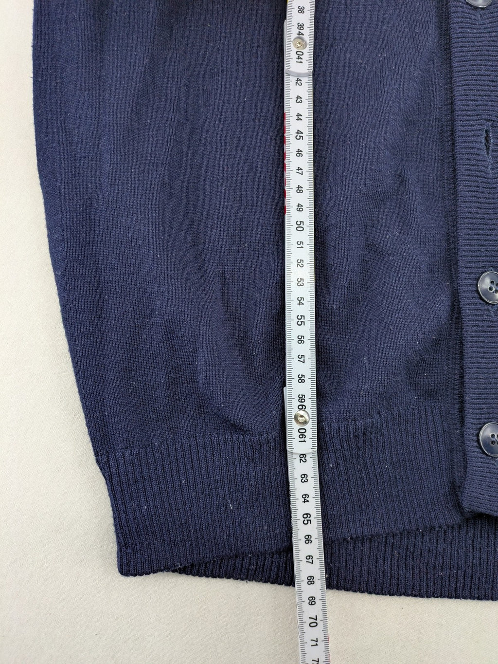 Schurwolle navy knit jumper classic V-neck with button placket, made from wool blend.