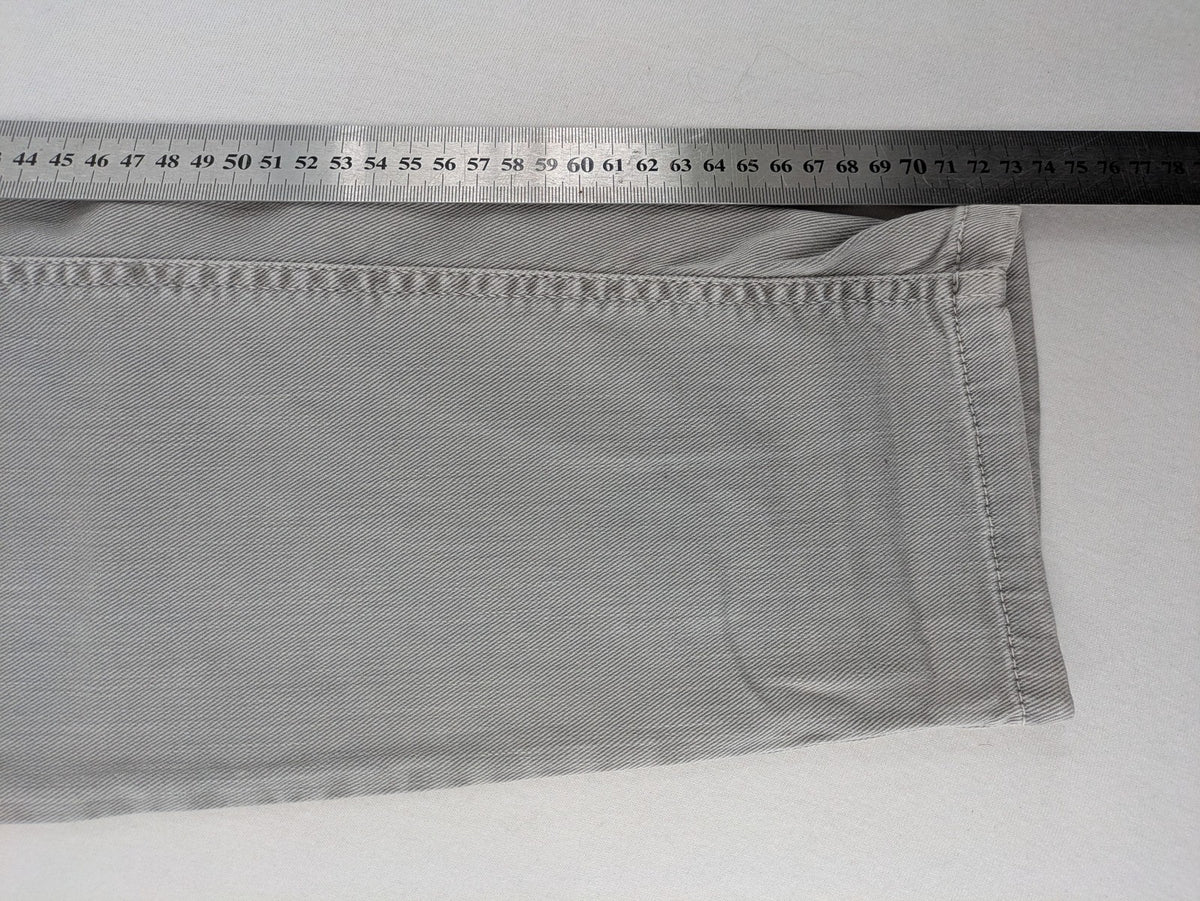 Cambio grey straight leg jeans with five-pocket design and logo button closure.