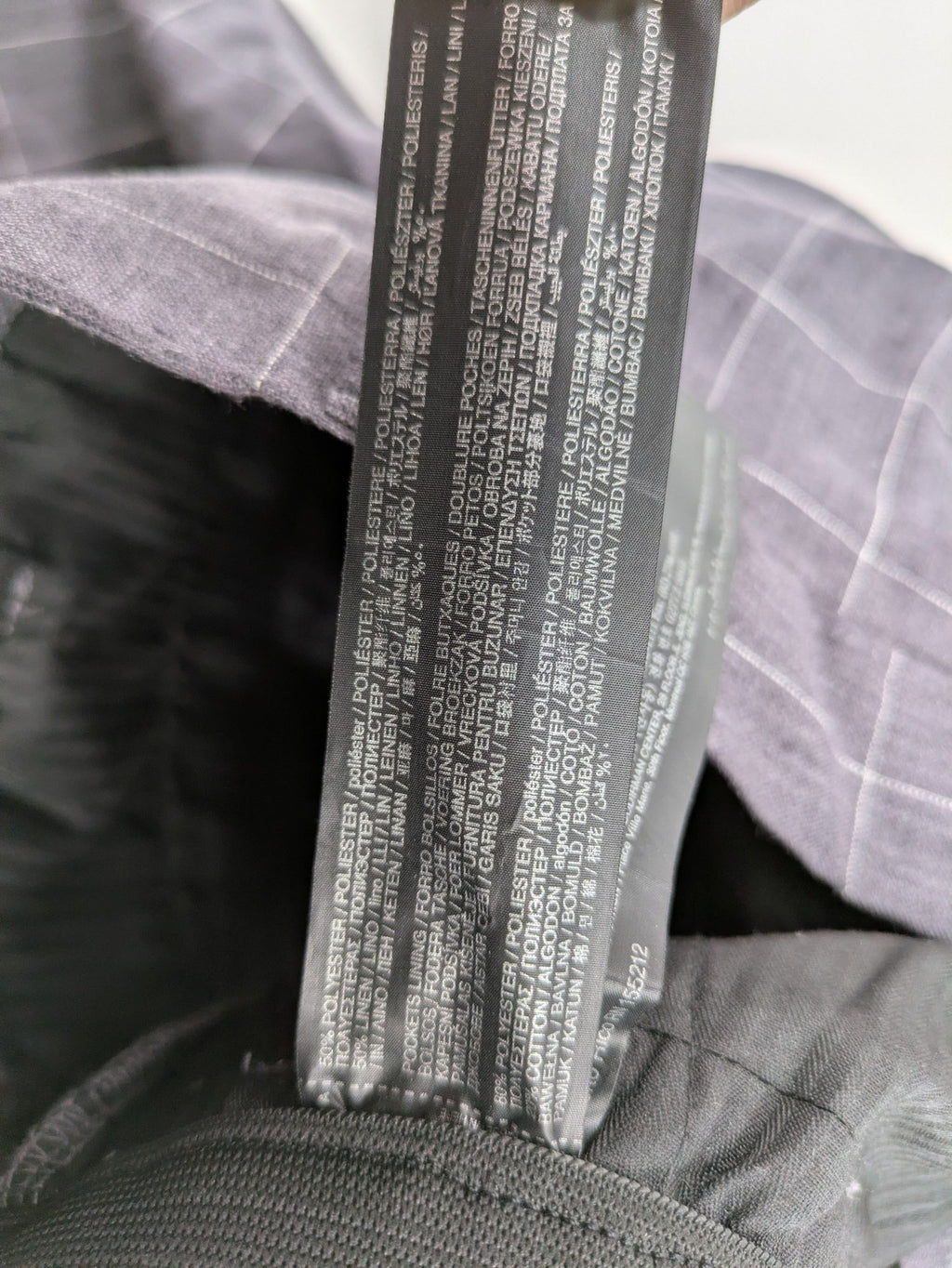 MNG Man grey plaid pants with rolled hem and stretch performance material.