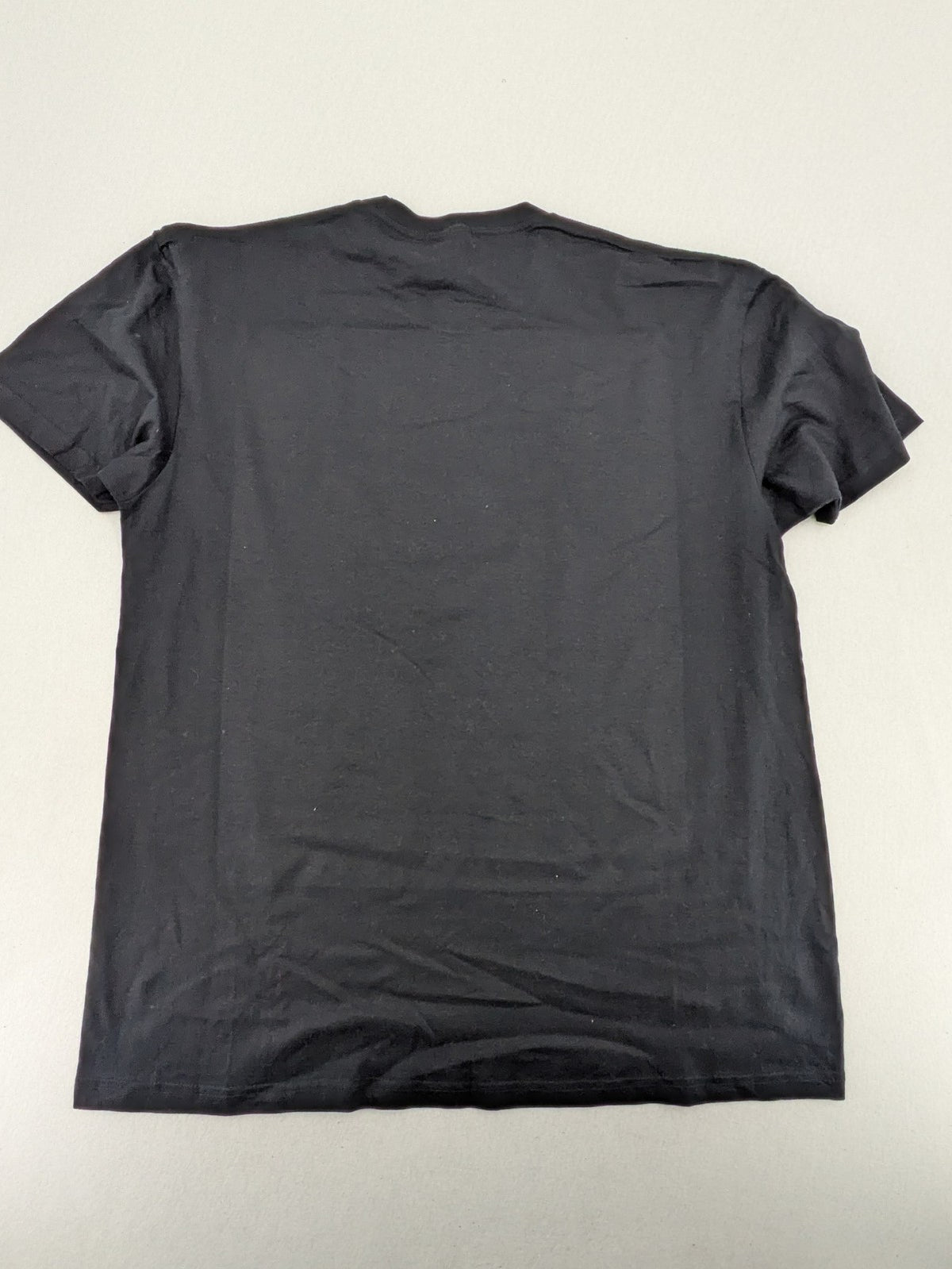 Dragon Ball Z blue and grey t-shirt featuring Son Goku evolution graphic, 100% cotton.