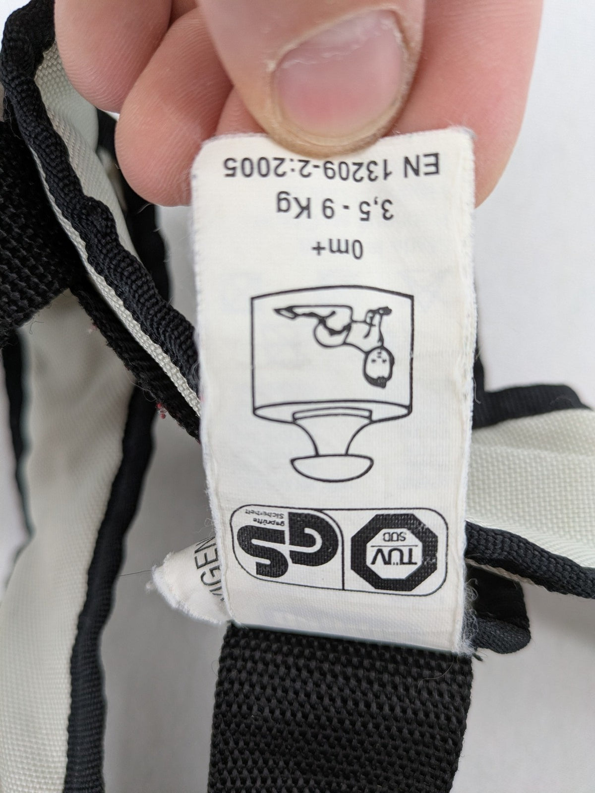 Chicco beige and black baby carrier adjustable straps with padded support for comfort.