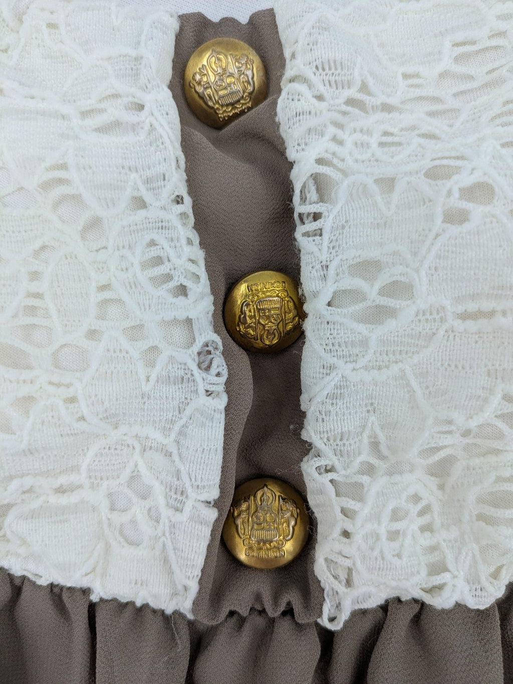 Creme bandeau summer dress in taupe with lace top and decorative gold buttons.