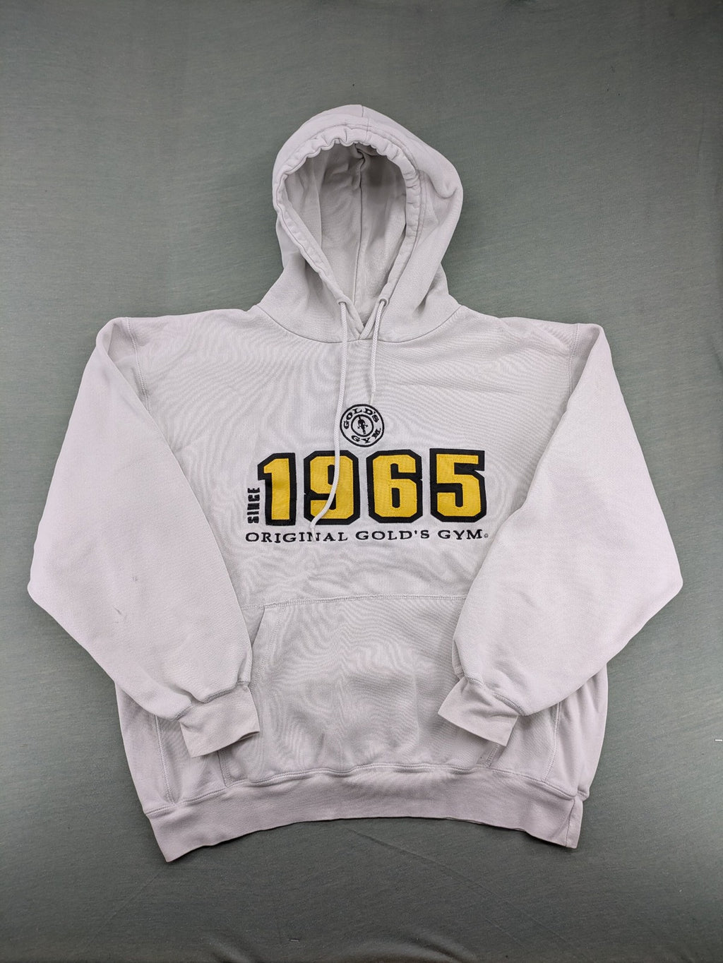 Gold's Gym grey hoodie with embroidered "Since 1965" logo and kangaroo pocket.