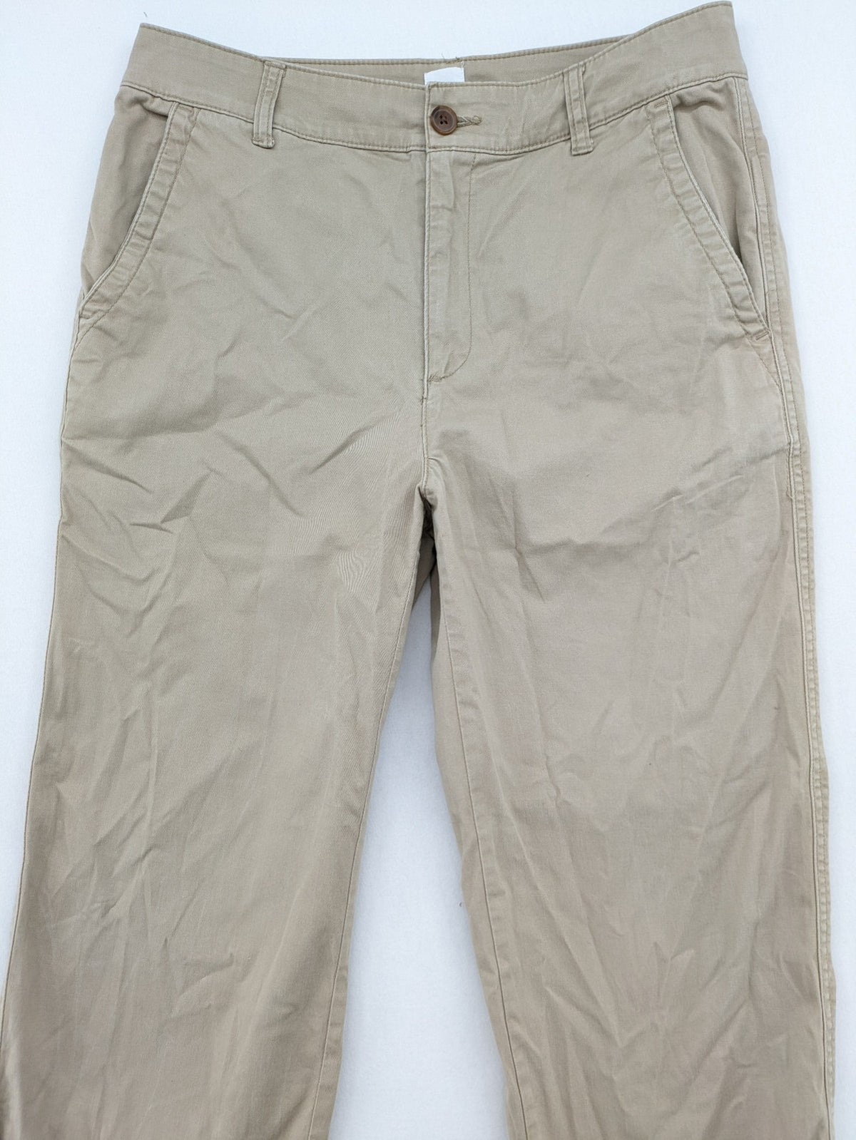 Gap beige girlfriend chino pants with relaxed fit and soft cotton-stretch blend.