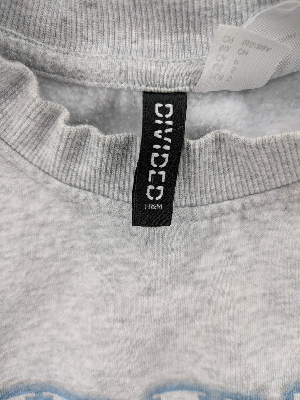 H&M Divided grey turtle neck jumper featuring Nirvana "In Utero" angel graphic.