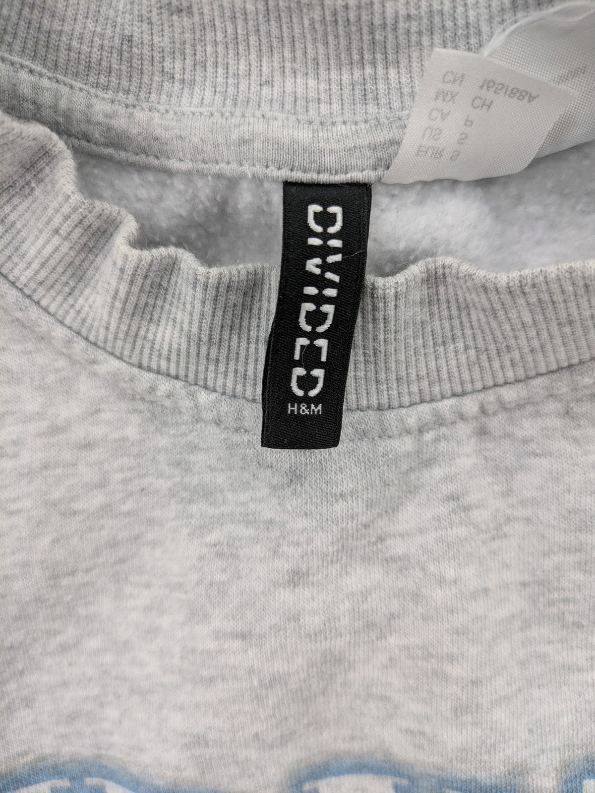 H&M Divided grey turtle neck jumper featuring Nirvana "In Utero" angel graphic.