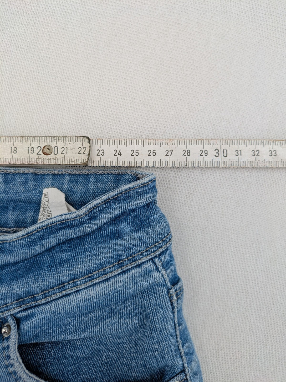 Metropoll blue high waist skinny jeans with frayed hem and classic 5-pocket design.