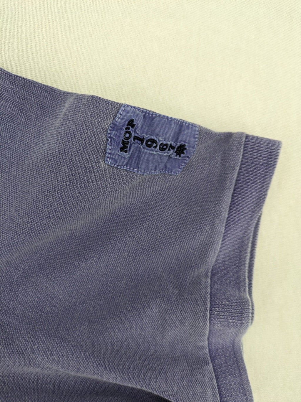 Marc O'Polo purple polo shirt garment dyed cotton with embroidered logo and intricate details.