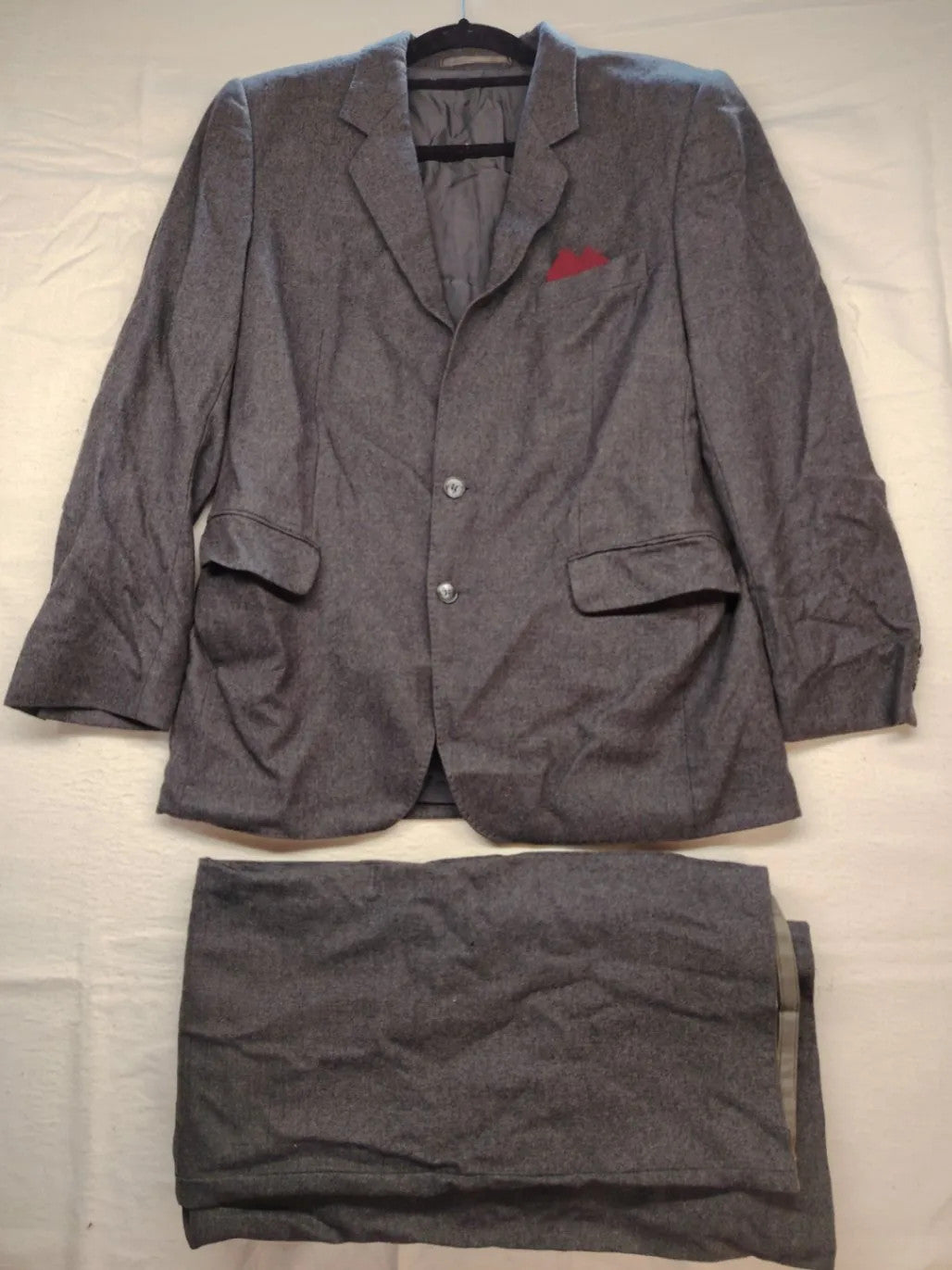 Adler pink two-piece suit, classic two-button design, luxurious wool-cashmere blend.
