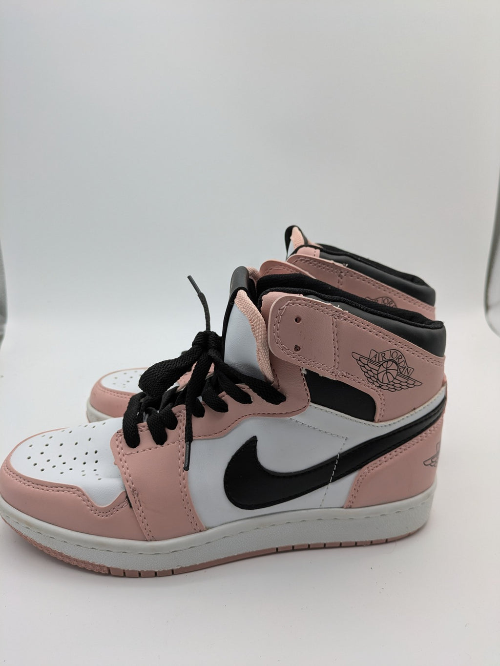 Nike Air Jordan high-top sneakers multi with Wings logo, Jumpman detail, and perforated toe.
