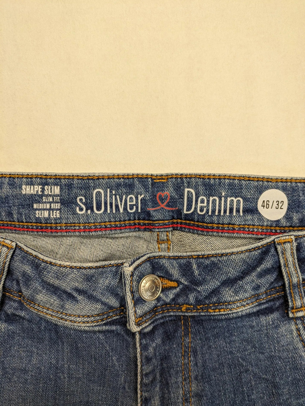 s.Oliver blue straight jeans with red and white side stripes, soft cotton blend material