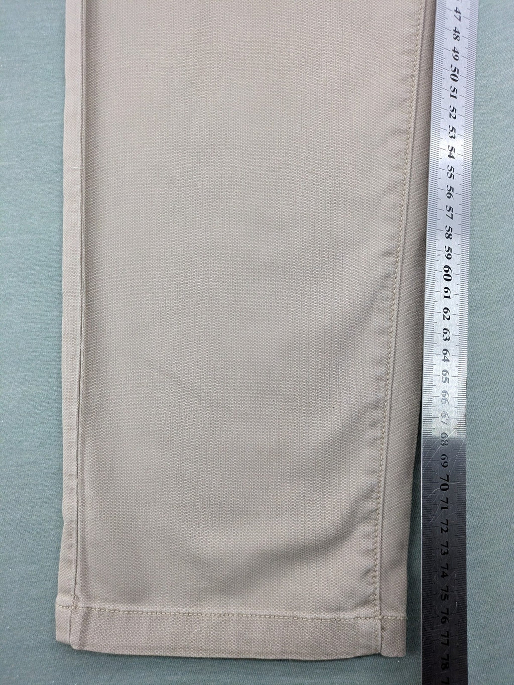 Marc O'Polo beige tapered fit chino pants, soft cotton stretch fabric, modern silhouette.