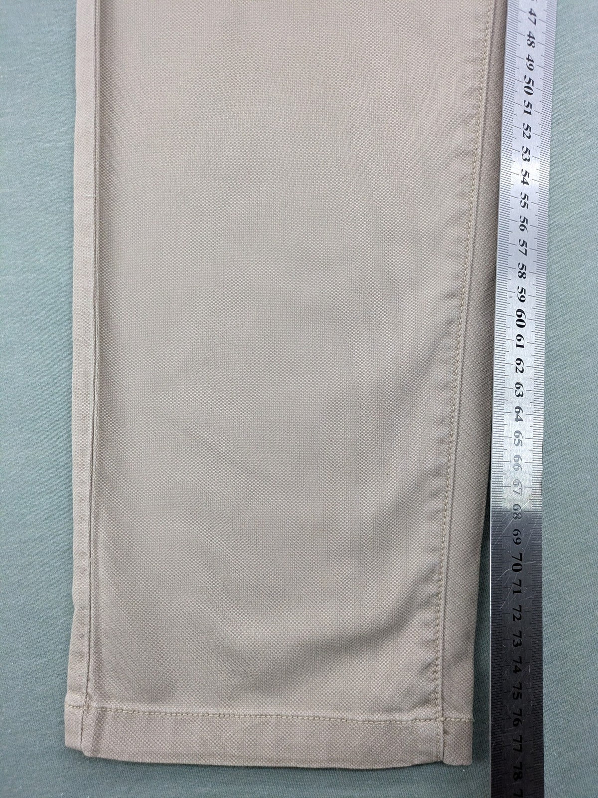 Marc O'Polo beige tapered fit chino pants, soft cotton stretch fabric, modern silhouette.