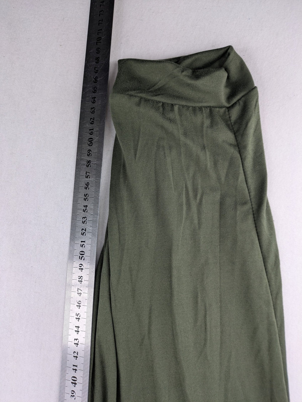 Infinity green jogger pants with elastic waistband and side pockets, soft stretch material.
