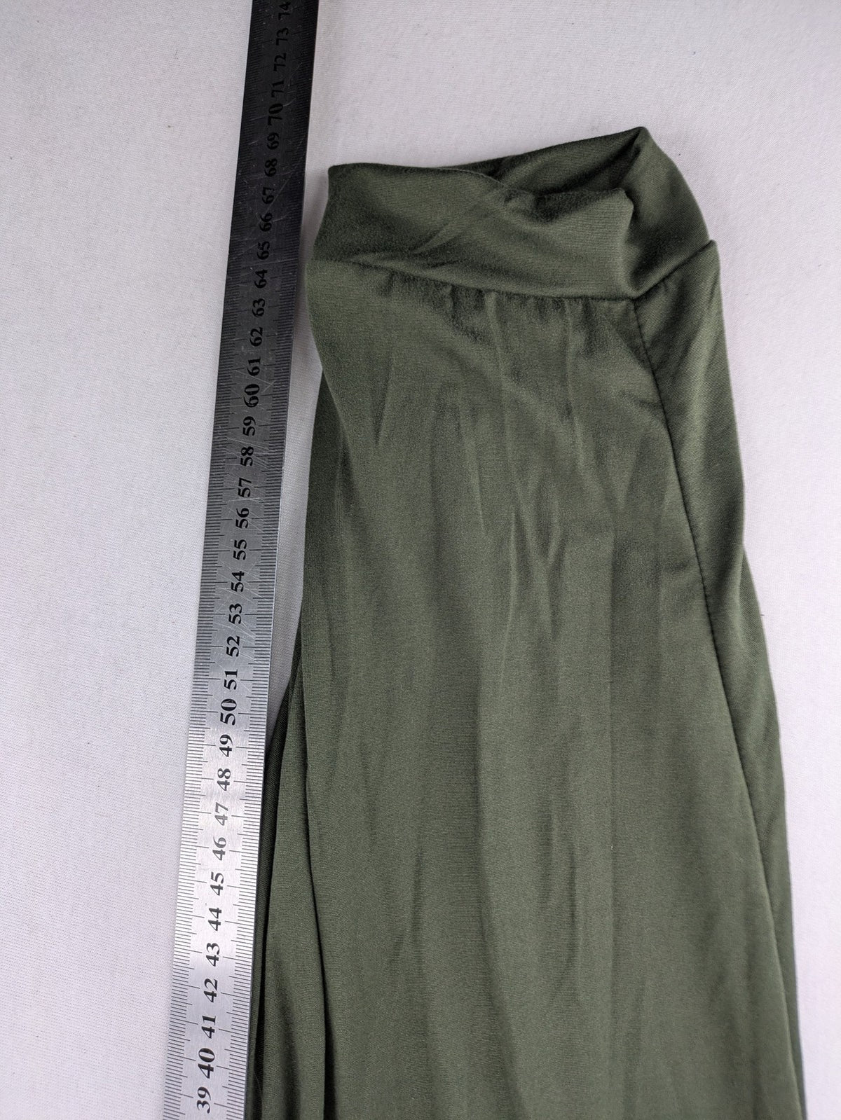 Infinity green jogger pants with elastic waistband and side pockets, soft stretch material.