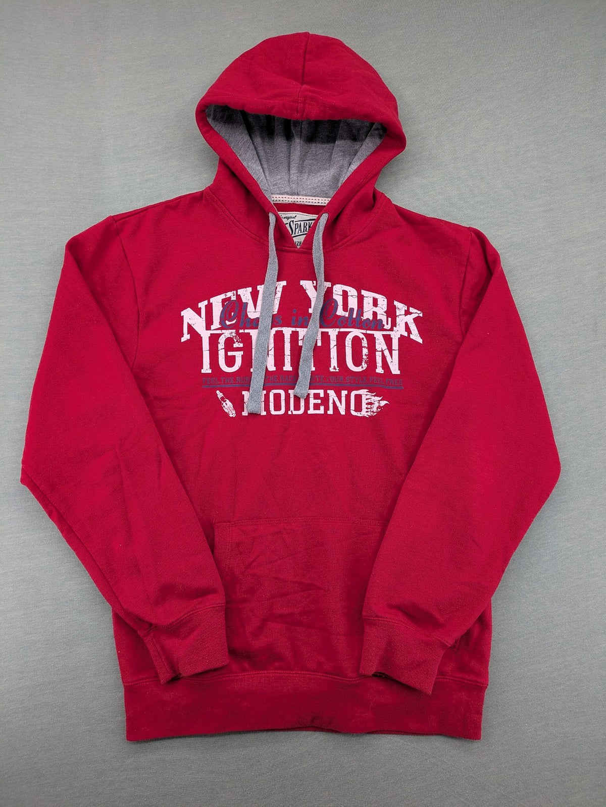 Sparks red zip-through hoodie with New York graphic print and grey hood.