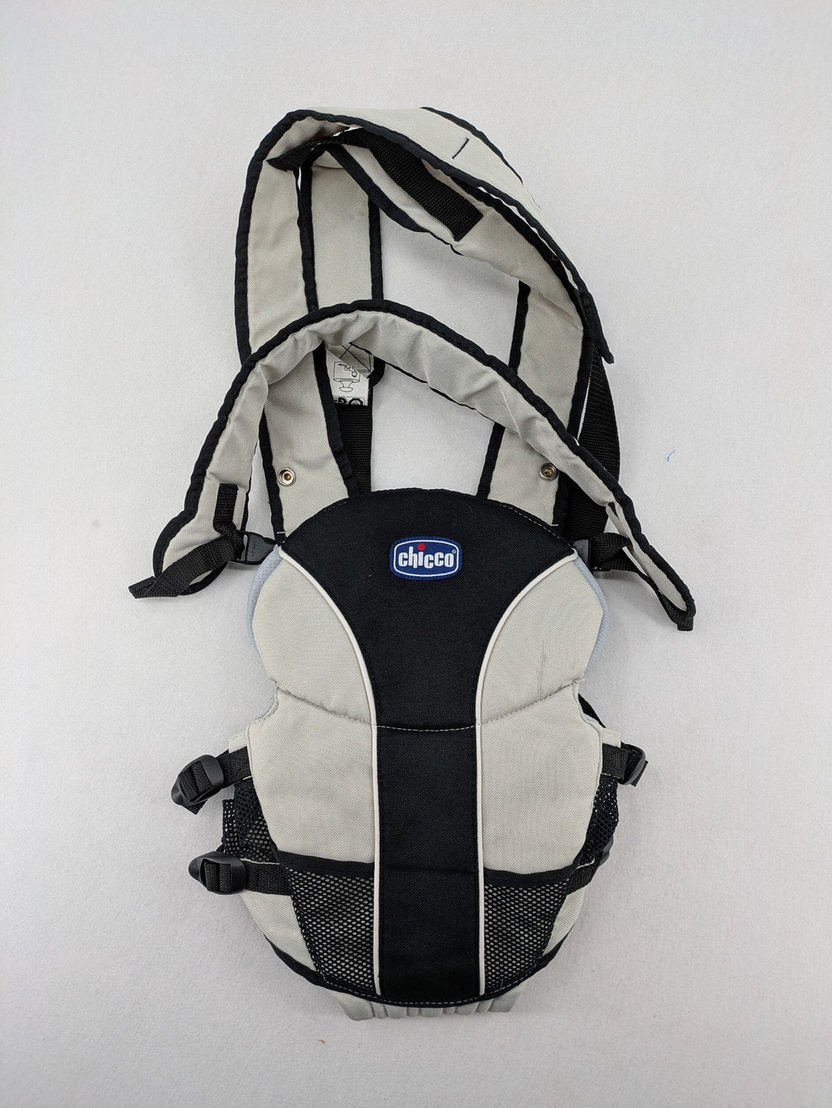 Chicco beige and black baby carrier adjustable straps with padded support for comfort.