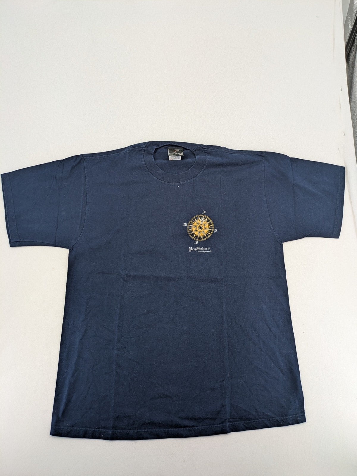 ProFishers navy t-shirt with compass print and large fish graphic on back.