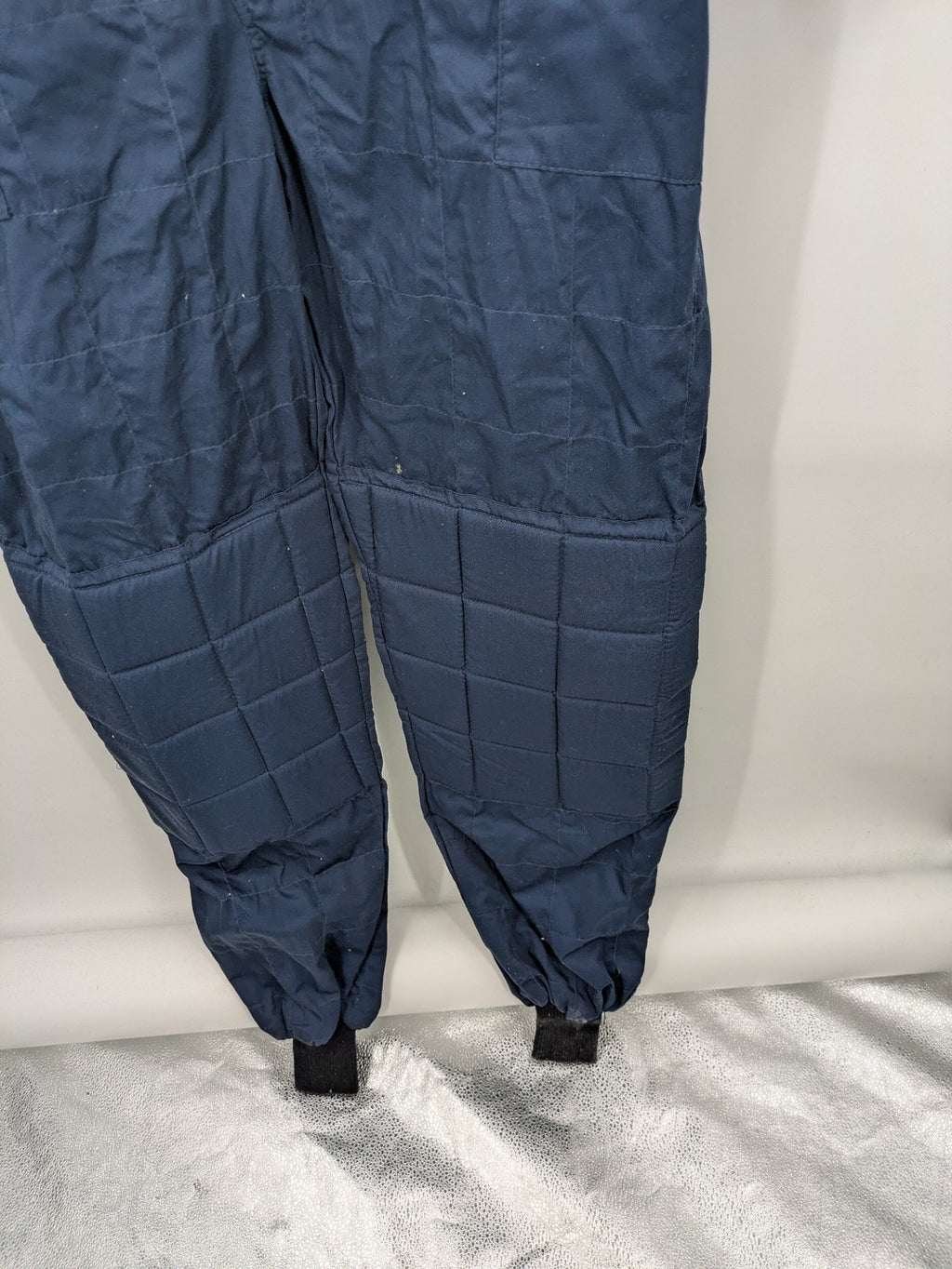 Hyundai Motorsport Sabelt racing suit navy blue with embroidered Shell and Michelin logos.