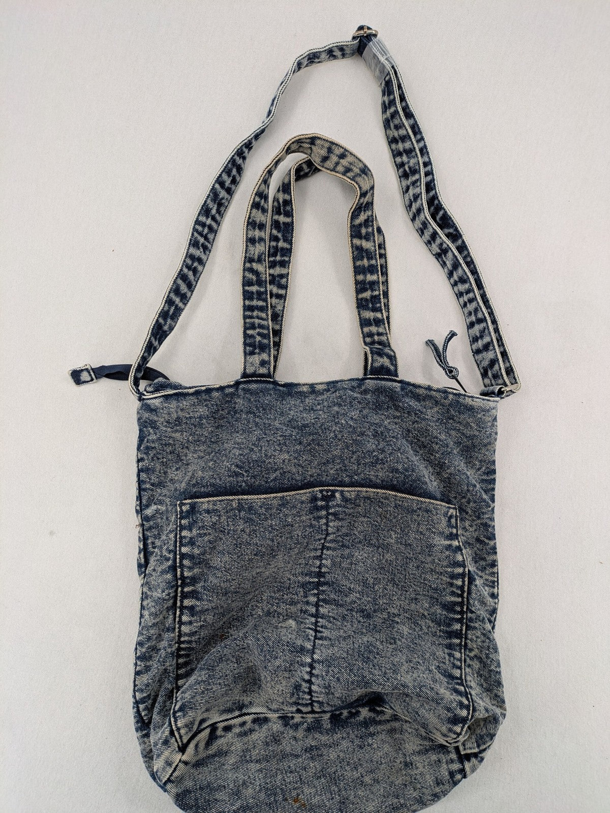 Clockhouse blue acid wash denim tote bag with adjustable shoulder strap and classic handles.