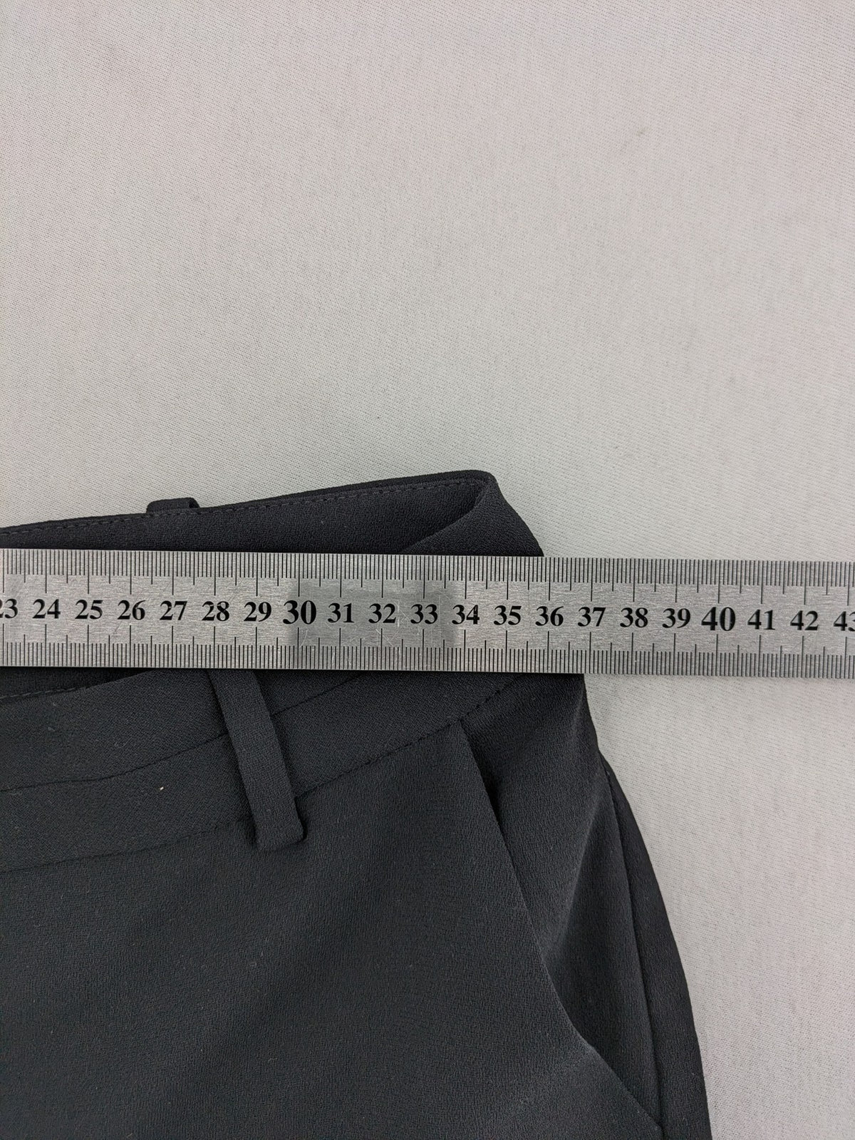 Mango Suit black trousers with zipper, belt loops, and front slant pockets.