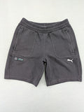 Puma grey sweatshorts featuring Mercedes AMG Petronas logo and elastic waistband.
