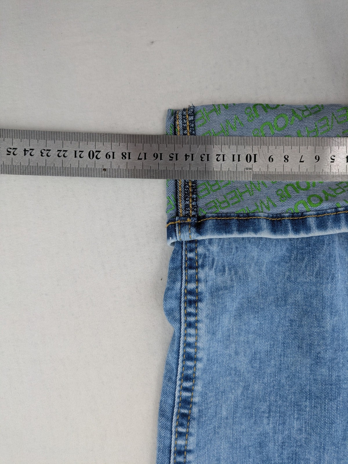 Street One blue straight jeans with green patterned cuffs and button fly detail.