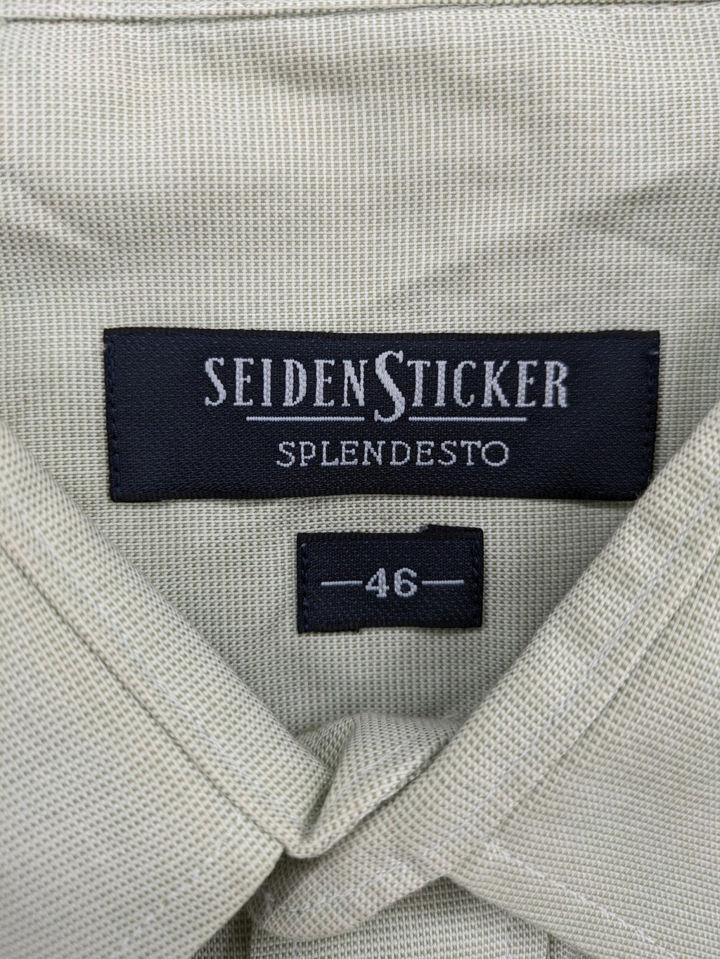 Seidensticker grey button-up shirt with subtle pattern and embroidered logo on pocket.
