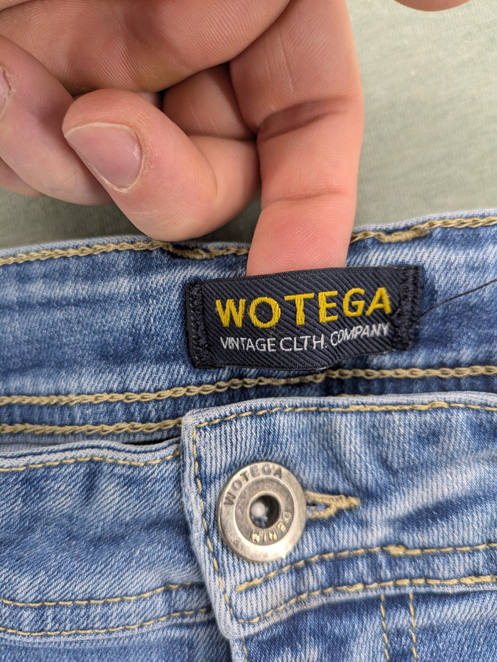 Wotega blue straight jeans light wash faded with classic 5-pocket design and stretch material.
