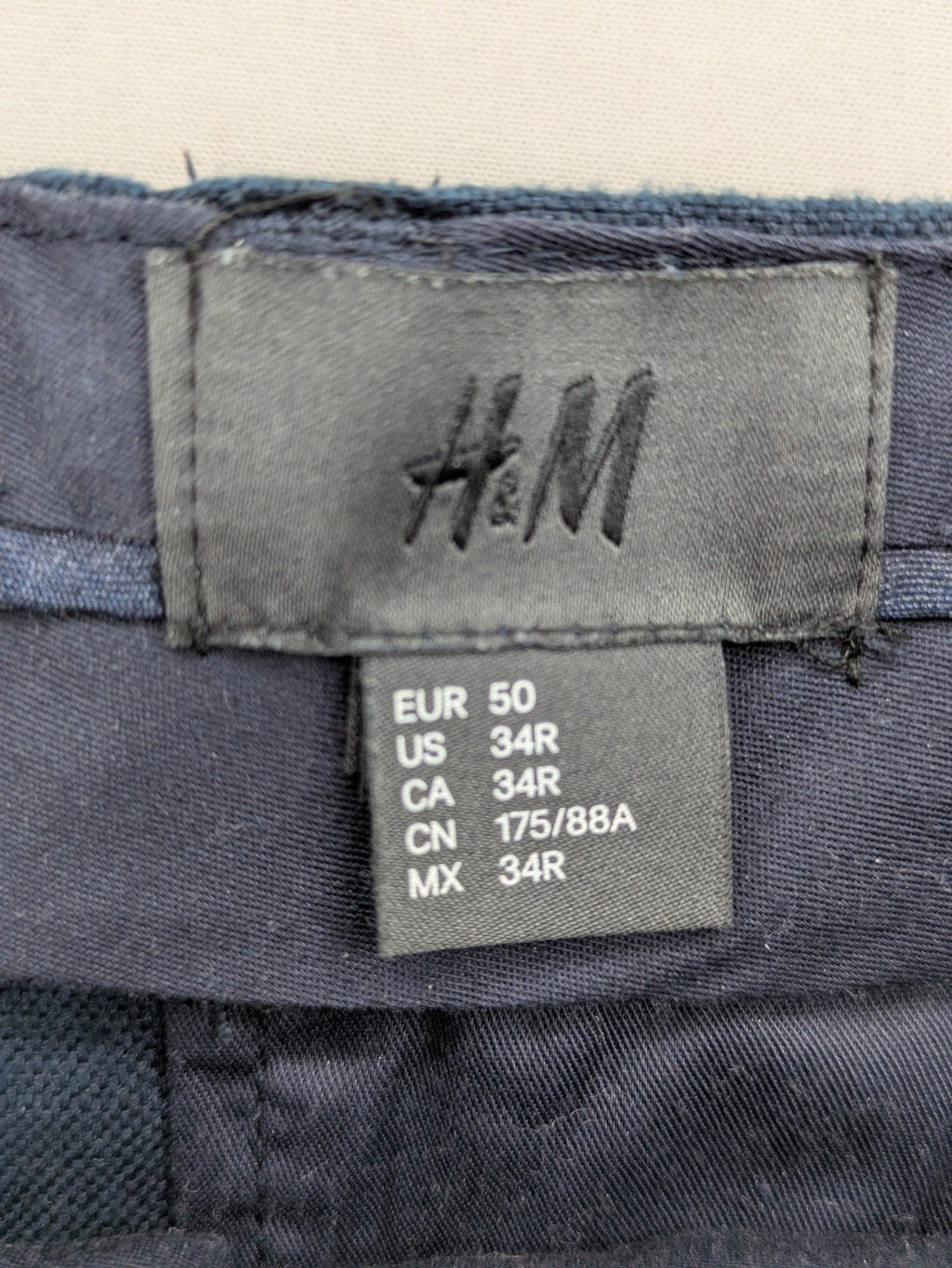 H&M blue linen shorts size 50 flat front design with practical pockets.
