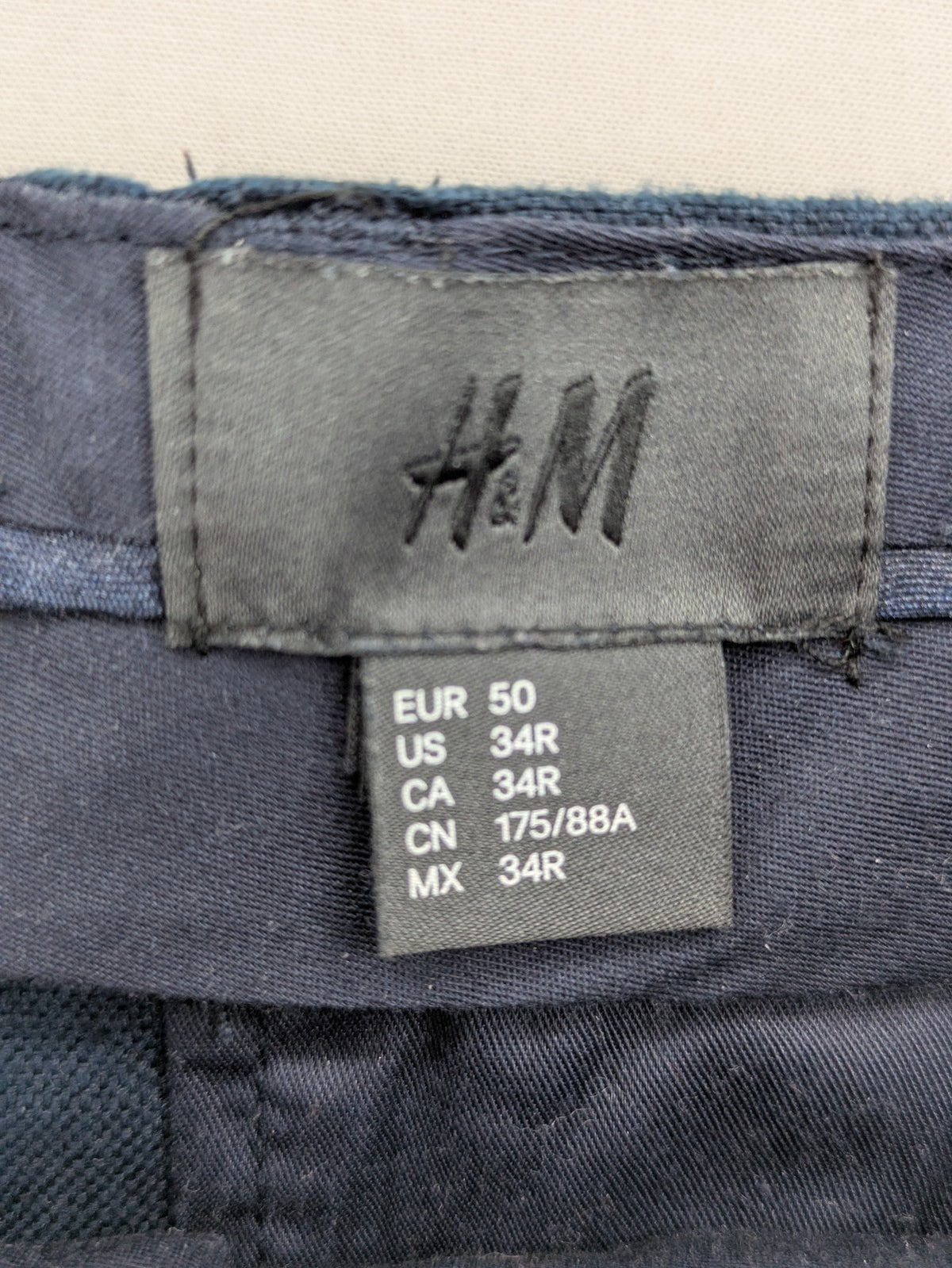 H&M blue linen shorts size 50 flat front design with practical pockets.