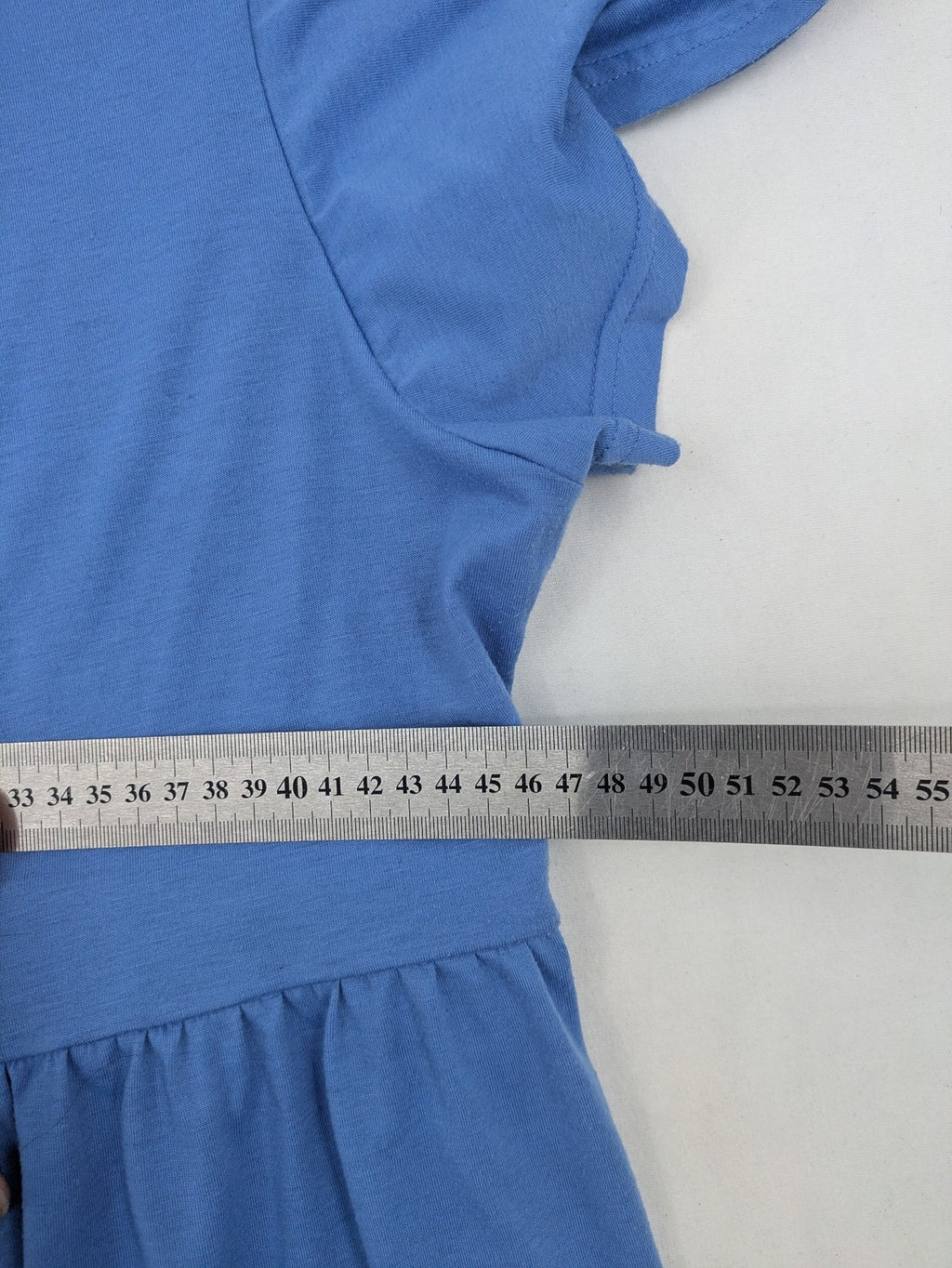 Infinity blue T-shirt dress A-line cut with playful flutter sleeves and soft stretch fabric.
