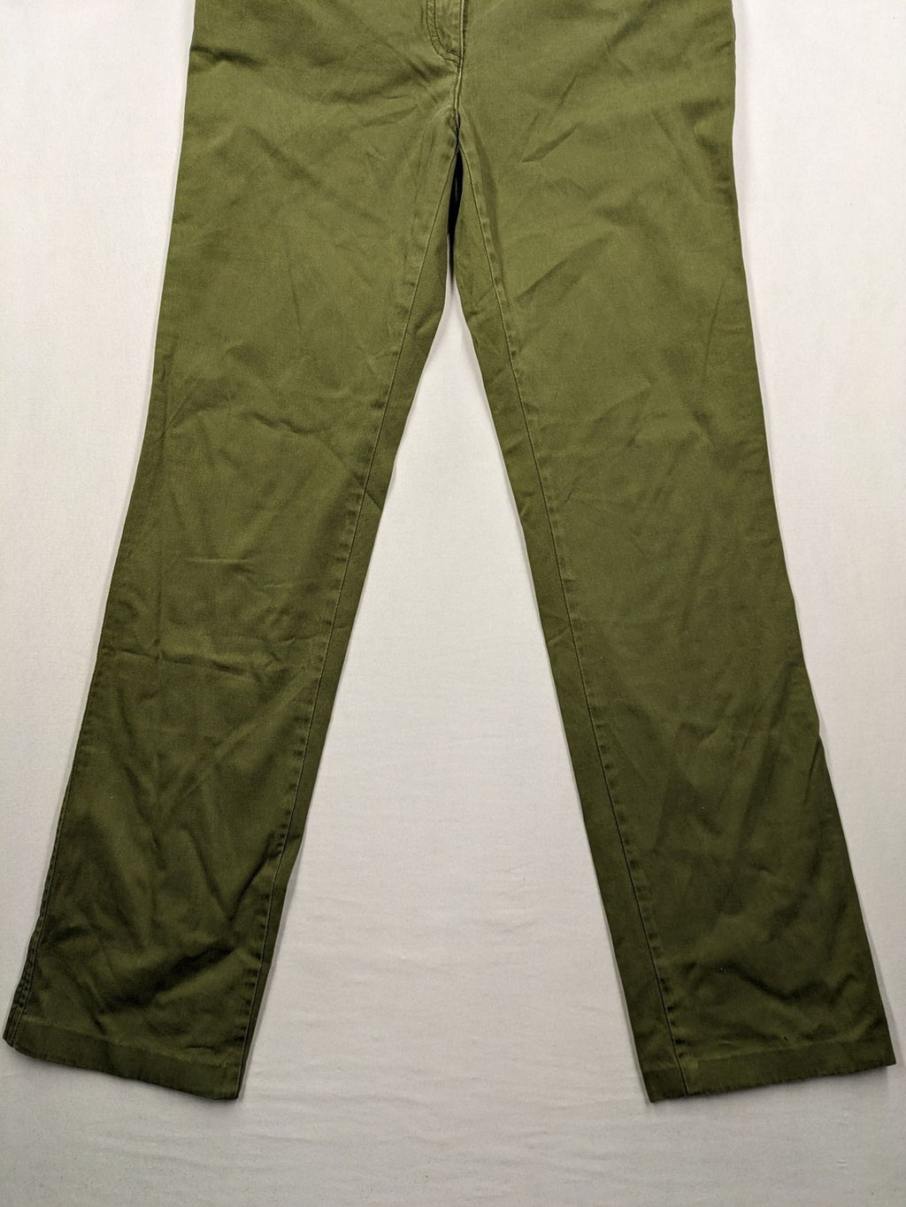 BRAX khaki pants classic five-pocket style with logo patch and zip button closure.