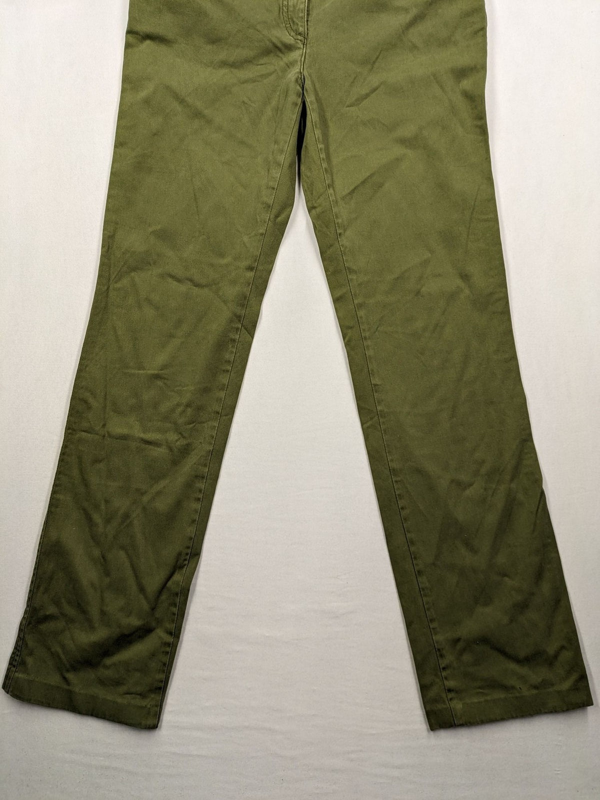 BRAX khaki pants classic five-pocket style with logo patch and zip button closure.