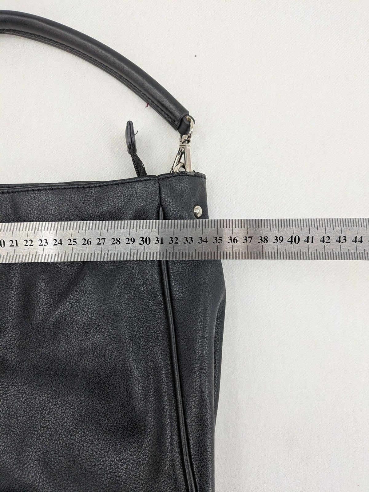 David Jones black hobo handbag pebbled PU leather with silver hardware and zipper closure.