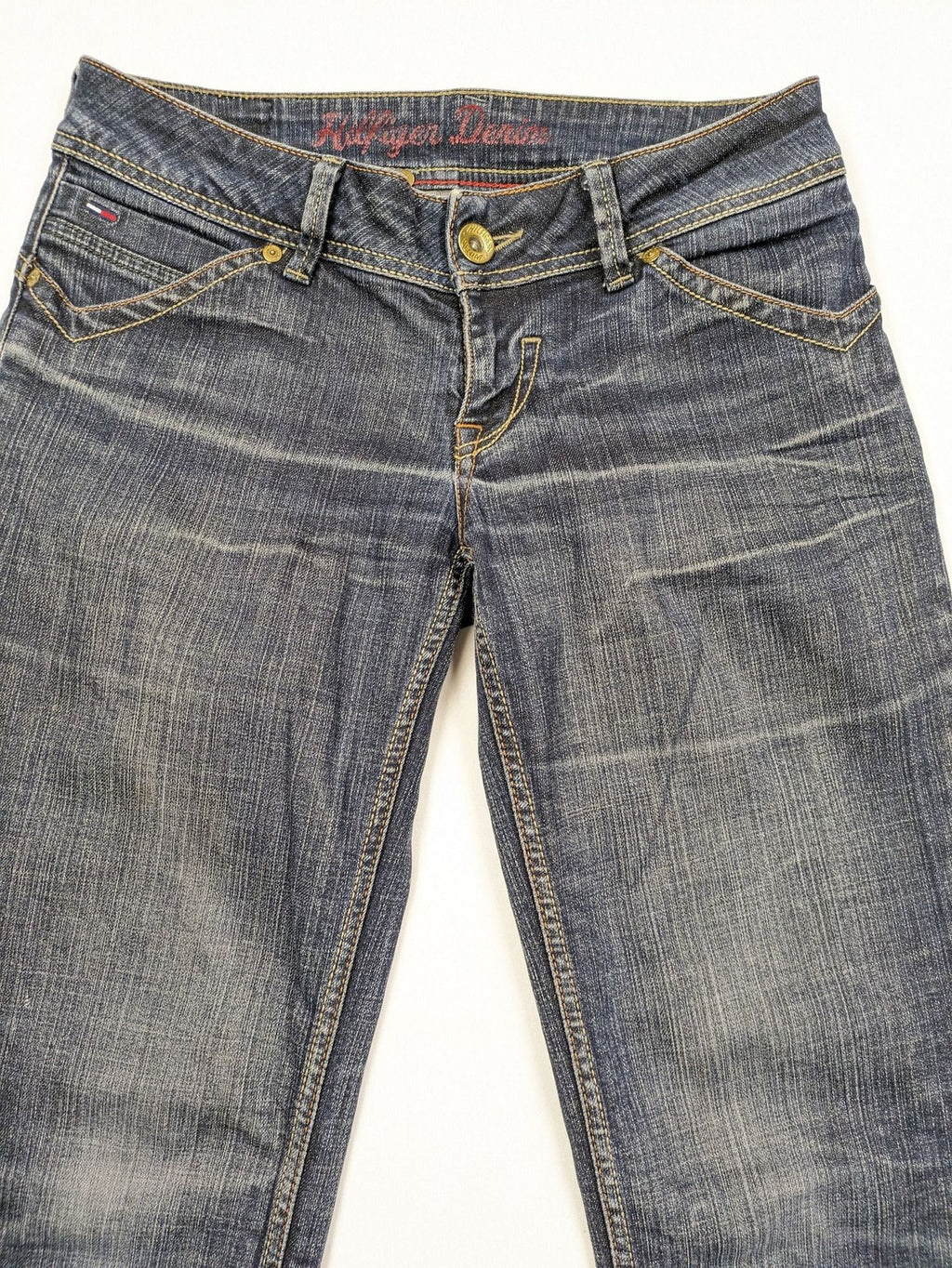 Tommy Hilfiger Denim blue straight jeans with low rise and slight used effects.