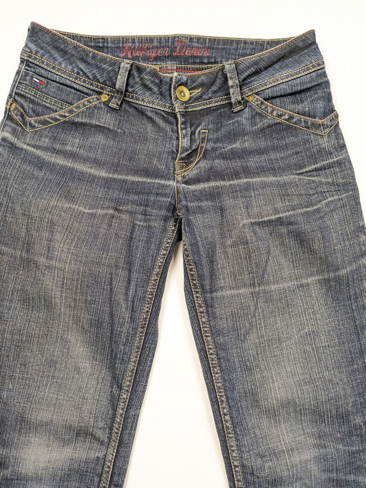 Tommy Hilfiger Denim blue straight jeans with low rise and slight used effects.