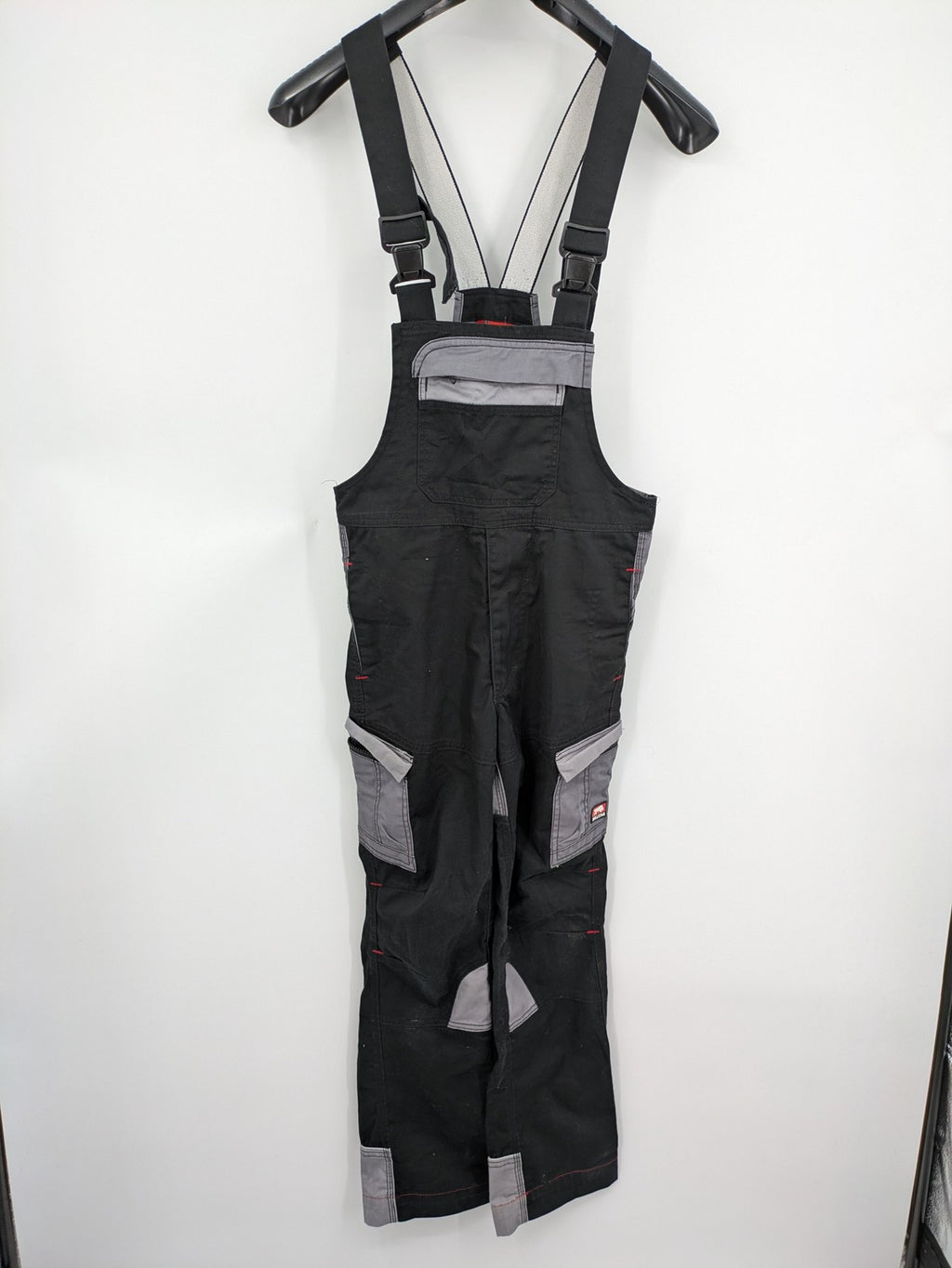 Cargo pants black grey two-tone design with red stitching and multiple pockets