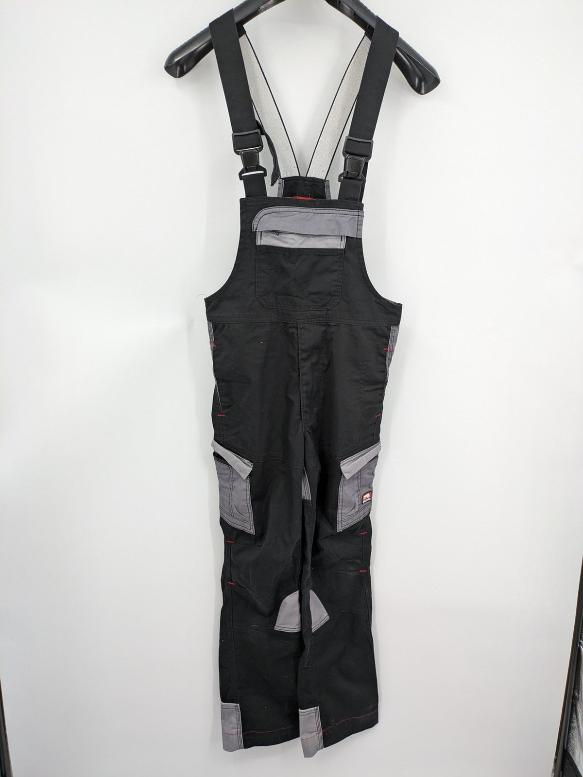 Cargo pants black grey two-tone design with red stitching and multiple pockets