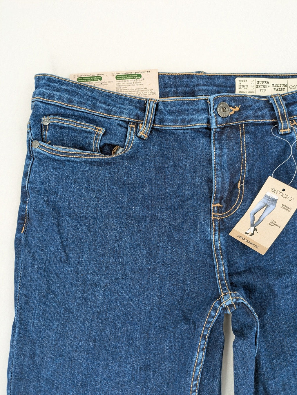 ESMARA blue super skinny jeans with dark wash and stretch denim material.