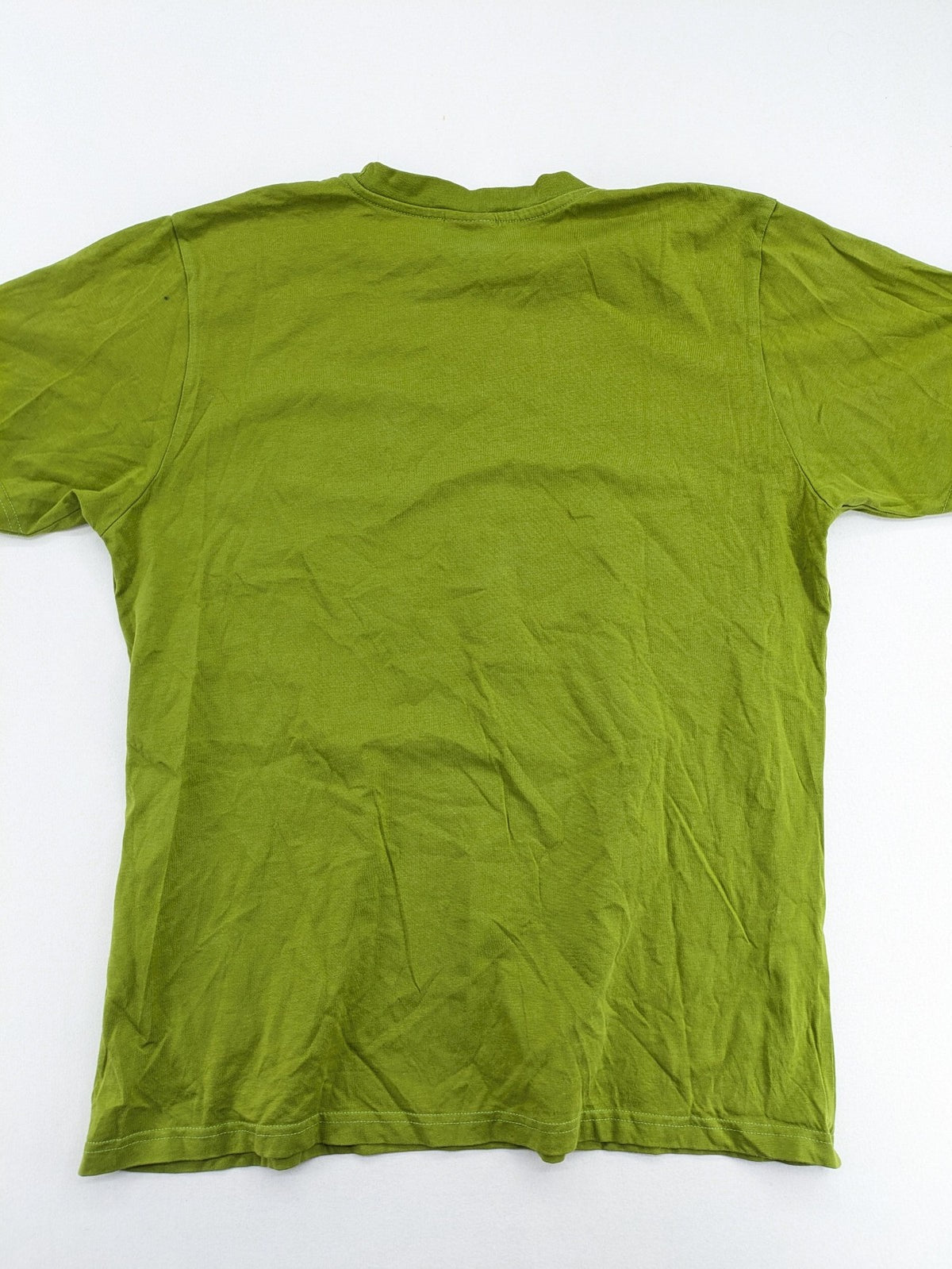 Lay Back green t-shirt with skull graphic, logo print, and short sleeves.