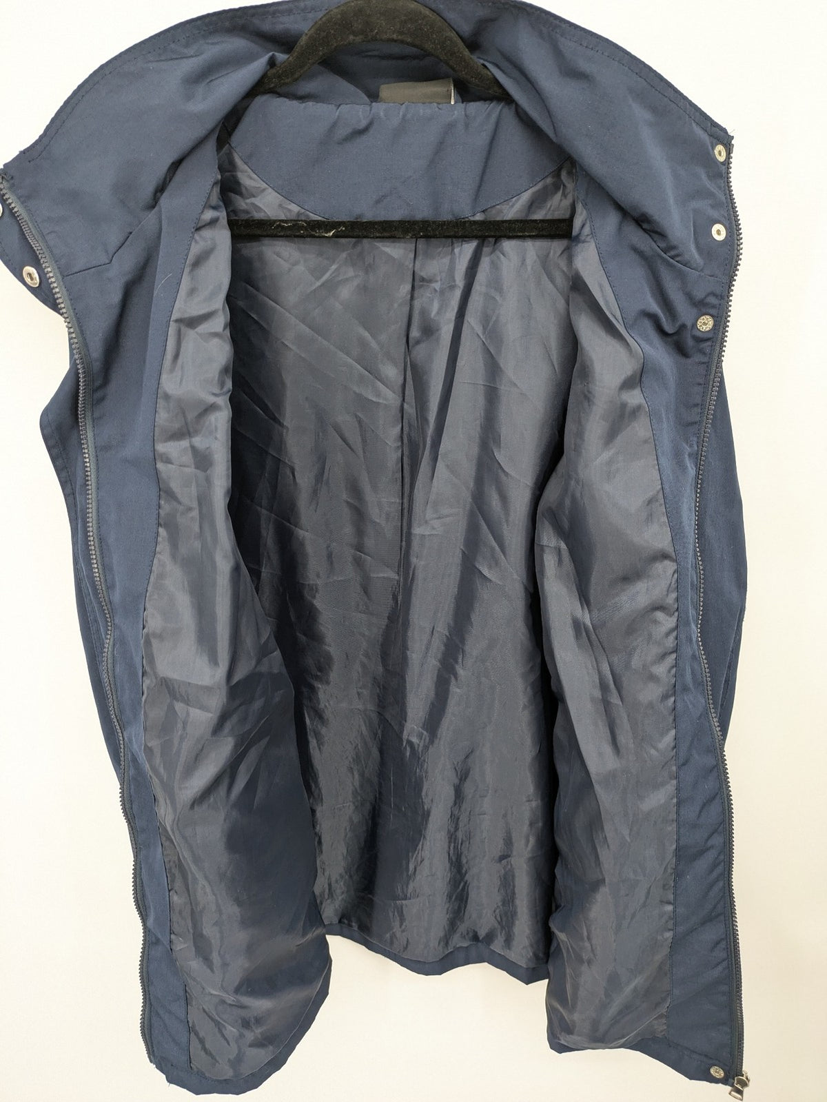 Janina navy anorak jacket with high collar and adjustable drawstring waist.
